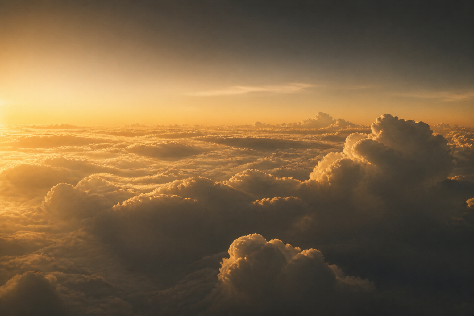 Sunlit clouds above the horizon